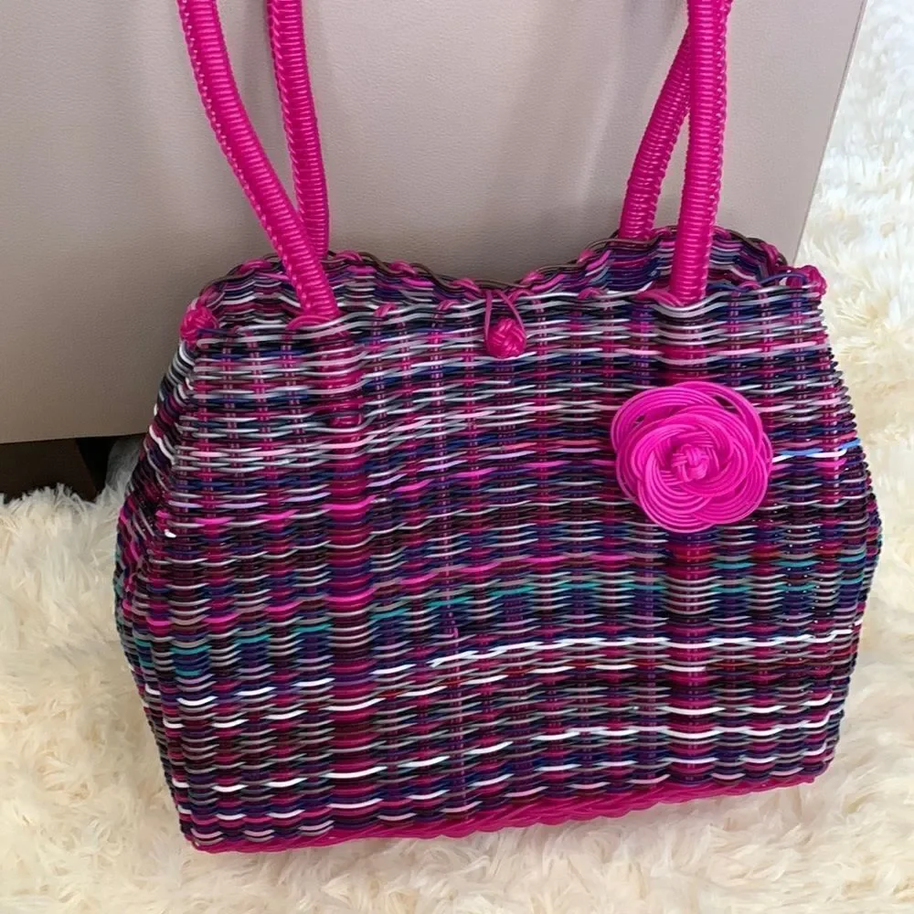 Handwoven plastic bag in multicolor with pink bottom and pink handles